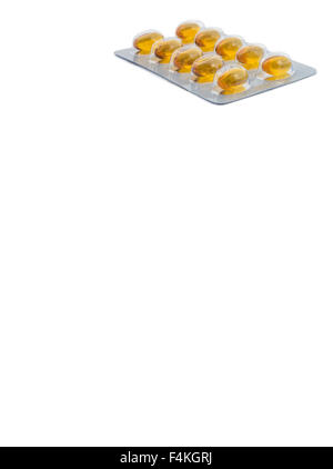 Alimento giallo supliment tablet con sfondo bianco Foto Stock