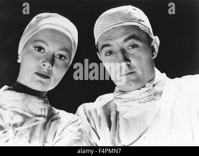 Olivia de Havilland e Robert Mitchum / non come un estraneo / 1955 diretta da Stanley Kramer [United Artists] Foto Stock