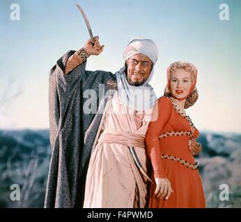 Rex Harrison e Virginia Mayo / re Richard e i crociati / 1954 diretto da David Butler [Warner Bros Foto] Foto Stock