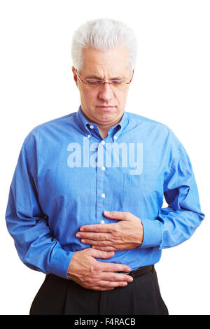 Senior Citizen tenendo la sua assenza per malattia pancia Foto Stock