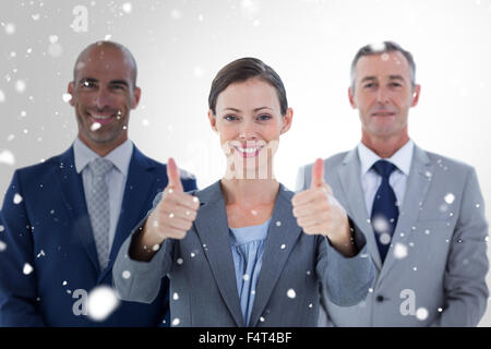 Immagine composita di colleghi d'affari sorridente in telecamera Foto Stock