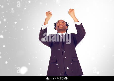 Immagine composita di happy businessman con bracci sollevati Foto Stock