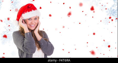 Immagine composita di festosa bionda sorridente in telecamera Foto Stock