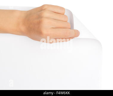 Womans mano girando pagina vuota corner Foto Stock