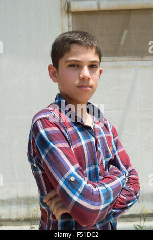 Rifugiato siriano nel centro UNCHR a Tripoli in attesa di registrazione e le cure. Tripoli, Libano 2015 Foto Stock