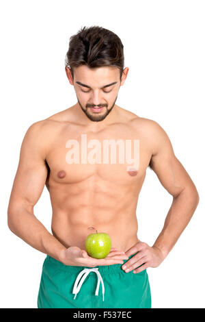 Bello e montare il giovane con un Apple isolato in bianco Foto Stock