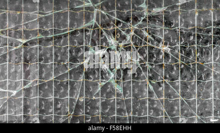 Extreme close-up di un vetro rinforzato rotto Foto Stock