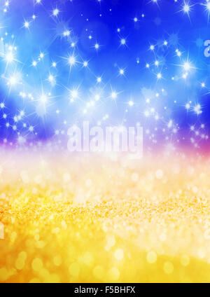 Abstract sfondo di Natale con stelle luccicanti in colore blu e oro. Nuovo anno luci, cielo stellato Foto Stock
