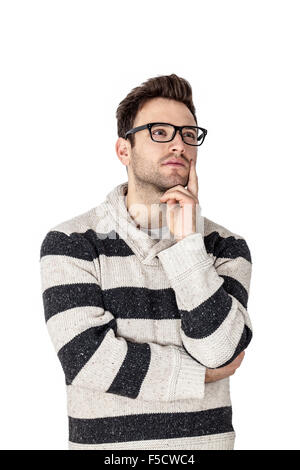 Ritratto di un giovane uomo di pensiero, isolata contro uno sfondo bianco Foto Stock