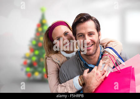 Immagine composita della coppia sorridente abbracciando Foto Stock