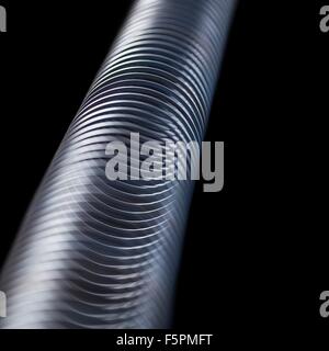 Onda longitudinale in una slinky molla. In direzione longitudinale (o compressione) onde lo spostamento è lungo l'asse di propagazione. Foto Stock