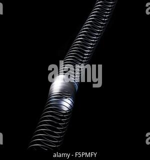 Onda longitudinale in una slinky molla. In direzione longitudinale (o compressione) onde lo spostamento è lungo l'asse di propagazione. Foto Stock