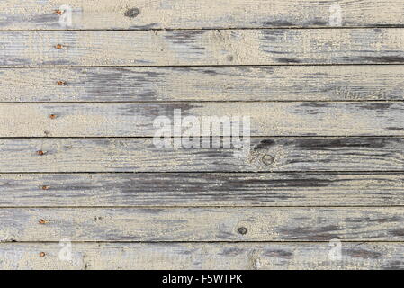 Vecchia scheda con i resti di una luce vernice gialla - sfondo Foto Stock