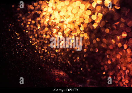 Abstract sfocati golden lights sfondo. Bokeh di fondo naturale foto patten Foto Stock