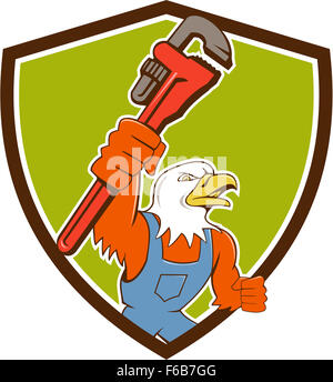 Illustrazione di un american aquila calva plumber holding Monkey Wrench guardando al lato impostato all'interno della protezione crest fatto in stile cartoon. Foto Stock