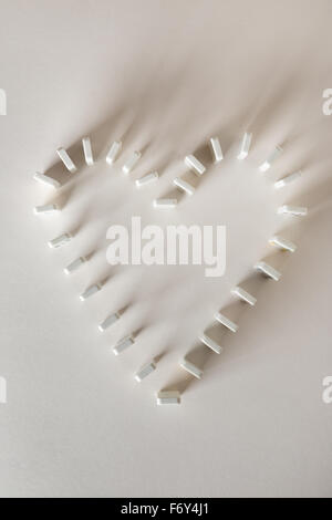 Domino a forma di cuore Foto Stock