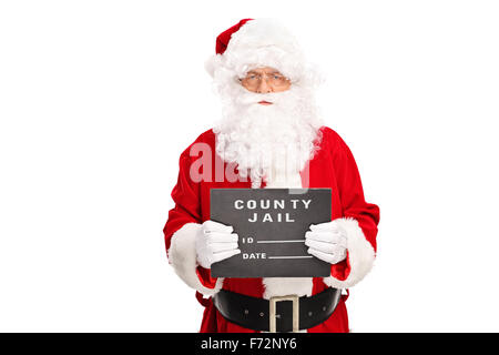 Studio shot di un criminale di Santa Claus in posa per una tazza shot con un bordo nero nel suo canto isolato su sfondo bianco Foto Stock