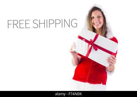 Immagine composita di pretty santa ragazza regalo di contenimento Foto Stock