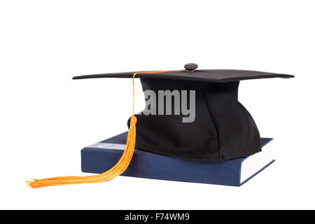 Tappo di graduazione sul Libro isolato Foto Stock
