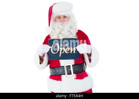 Immagine composita di sorridere santa claus azienda pagina Foto Stock