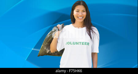 Immagine composita del team di volontari il prelievo di lettiera in posizione di parcheggio Foto Stock