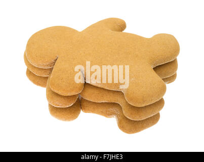 Una piccola pila di pane appena sfornato gingerbread uomini isolati su uno sfondo bianco. Foto Stock