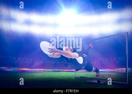 Immagine composita del giocatore di rugby con un punteggio provare Foto Stock