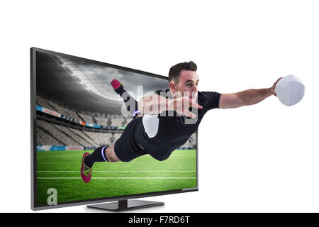 Immagine composita del giocatore di rugby con un punteggio provare Foto Stock