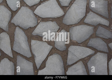 Muro di pietra naturale background / lastricato in pietra piano Foto Stock
