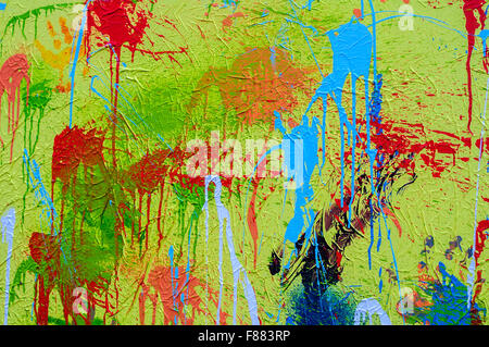 Schizzi di diversi colori su tela Foto Stock