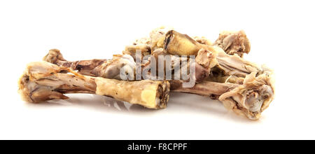 Le ossa del pollo su sfondo bianco Foto Stock