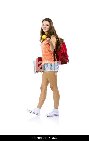 Giovane e bella ragazza dello studente con il sacchetto di contenimento, cartelle isolato su sfondo bianco Foto Stock