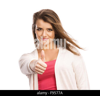 Felice giovane donna con il pollice in alto isolato su sfondo bianco Foto Stock