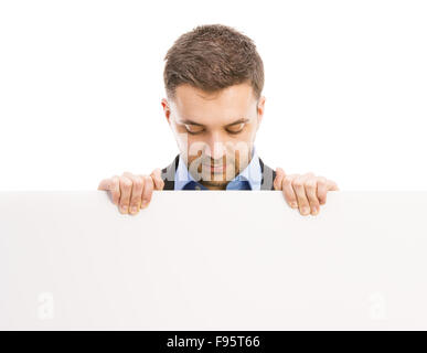 Business di successo di uomo è in posa con la copia in bianco lo spazio. Manager è isolato su sfondo bianco. Foto Stock