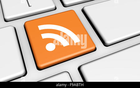 RSS feed web e Internet news concetto con icona e simbolo su un computer portatile chiave per blog e business online. Foto Stock
