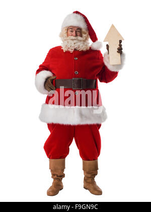 Babbo Natale con freccia in legno che indica la direzione verticale completi Foto Stock