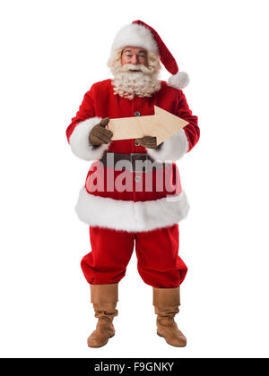 Babbo Natale con freccia in legno che indica la direzione verticale completi Foto Stock