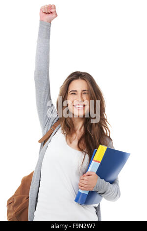 Emozionato studentessa alzando la mano mano isolati su sfondo bianco. Foto Stock