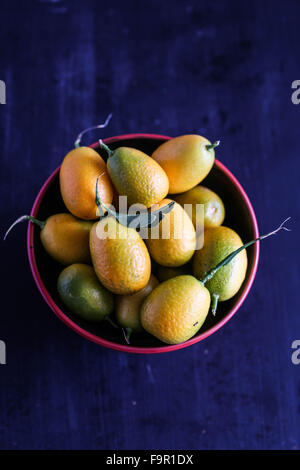 Dettaglio di Kumquat in una ciotola Foto Stock