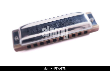 Foto stilizzata di una armonica o armonica a bocca. Il tipo è una Hohner Blues Harp. Foto Stock