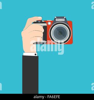 Illustrazione vettoriale di una mano azienda fotocamera reflex digitale per il tuo design Illustrazione Vettoriale