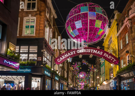 Le luci di Natale su Carnaby Street, London REGNO UNITO Foto Stock