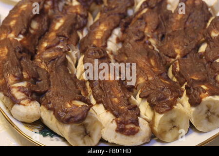 Le banane con il cioccolato Foto Stock