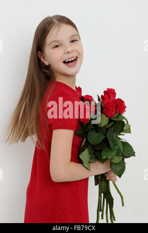 Bambina e red rose Foto Stock