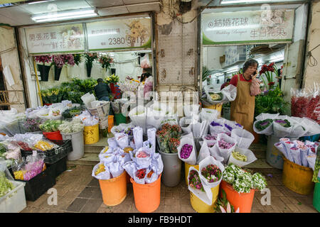 Scene dal vivace Mercato dei Fiori in Mongkok, Hong Kong Foto Stock