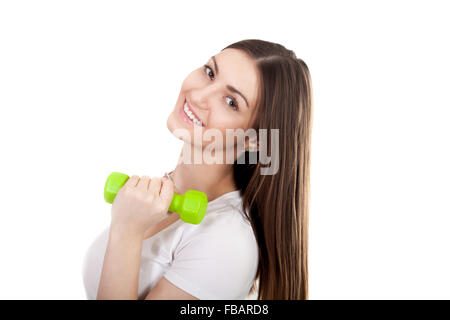 Giovane donna sorridente holding di color verde dumbbell, treni bicipite, peso di sollevamento, allenamento, facendo esercizi di fitness. Isolato su Foto Stock