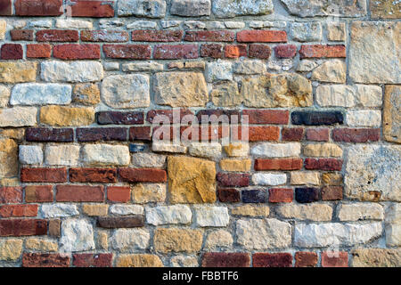 In mattoni e pietra di cotswold parete pattern texture Foto Stock