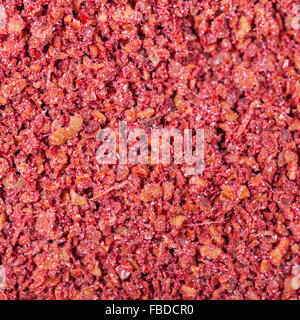 Piazza sfondo alimentare - sumac ( sumach, rhus) spice close up Foto Stock