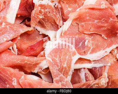 Sfondo di cibo - sottili fette di dry-cured ham close up Foto Stock