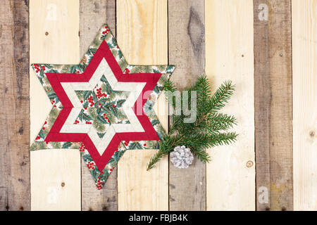 Decorazione di natale, stella di tessuto, ramoscello Foto Stock